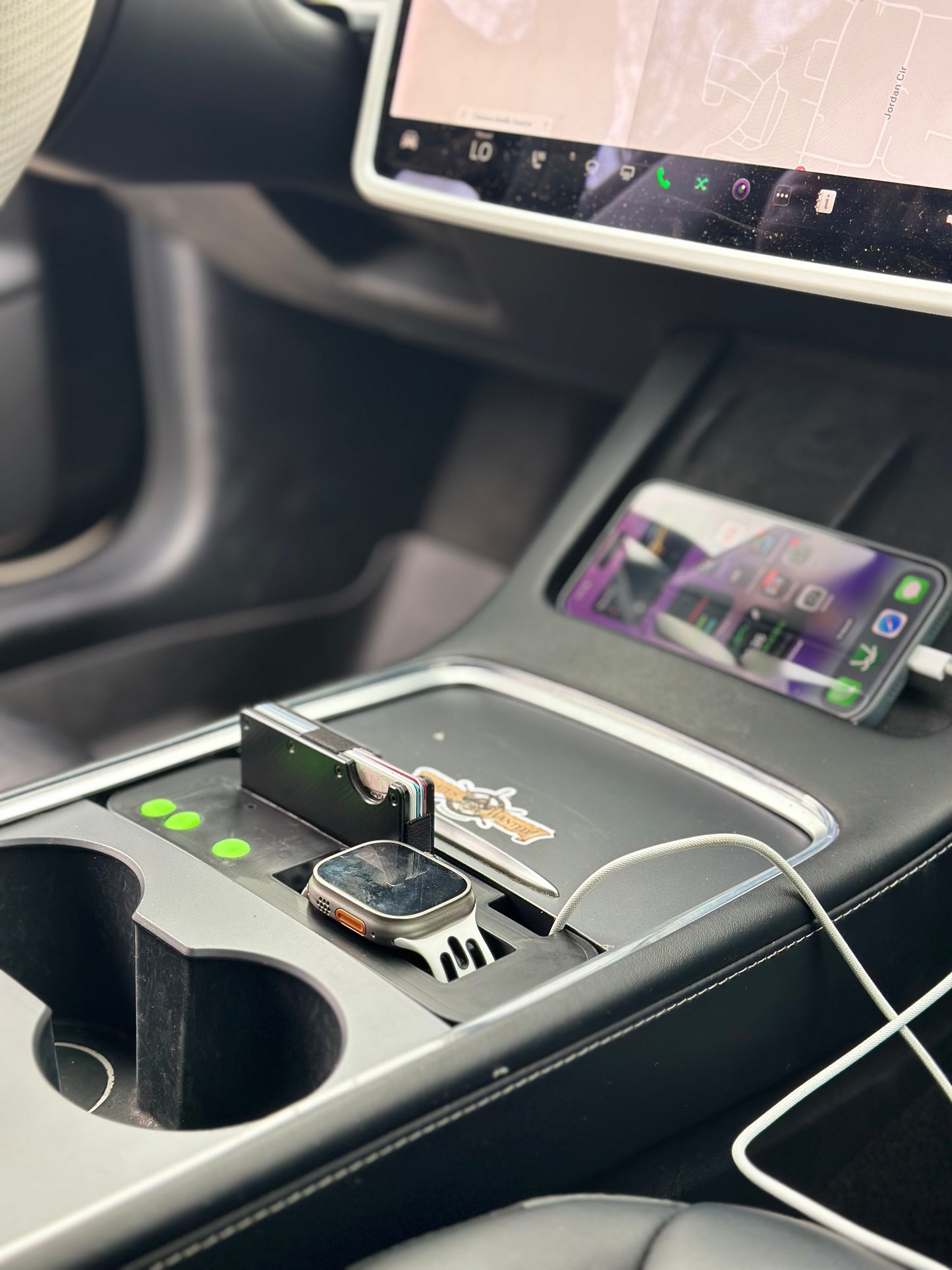 UniHub Control Panel for Tesla Model 3 & Model Y (2021–Present) installed in center console with Apple Watch and smartphone charging. Enhances organization and device connectivity.