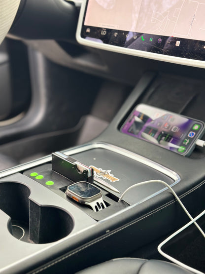 UniHub Control Panel for Tesla Model 3 & Model Y (2021–Present) installed in center console with Apple Watch and smartphone charging. Enhances organization and device connectivity.