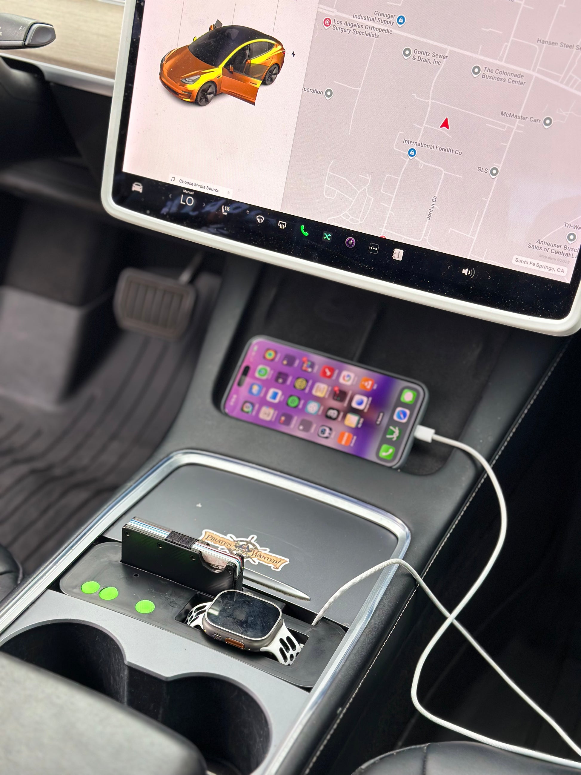 UniHub Control Panel for Tesla Model 3 & Model Y (2021–Present) installed in center console with phone charging and organized accessories.