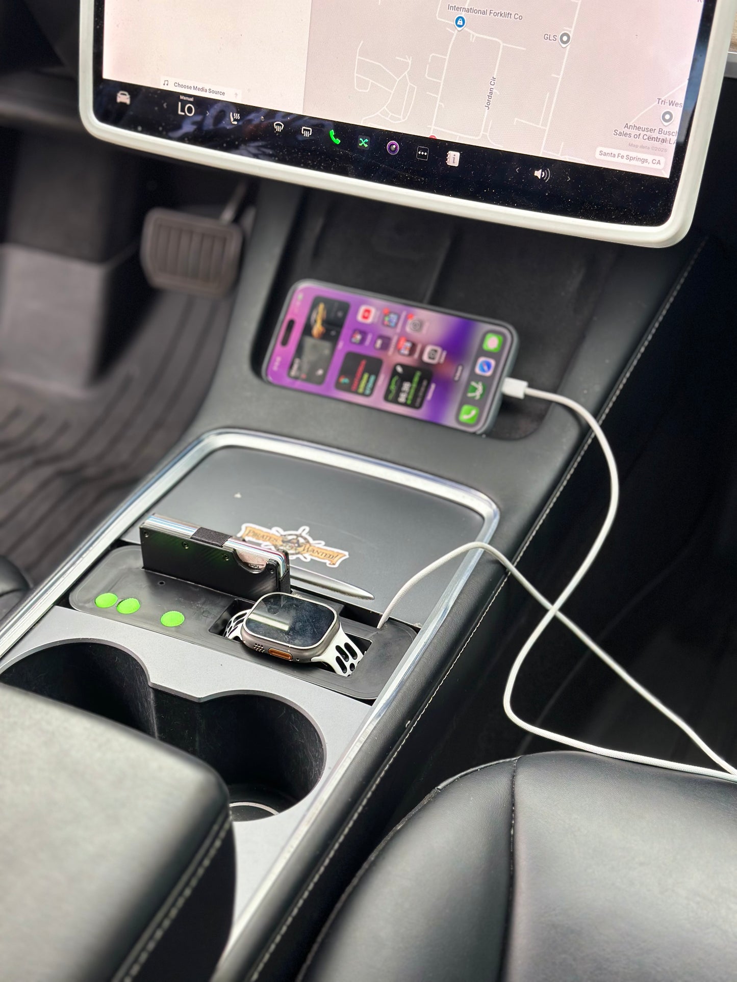 UniHub Control Panel for Tesla Model 3 & Model Y (2021–Present) installed in center console, featuring wireless charging for smartwatch and smartphone with organized compartments.