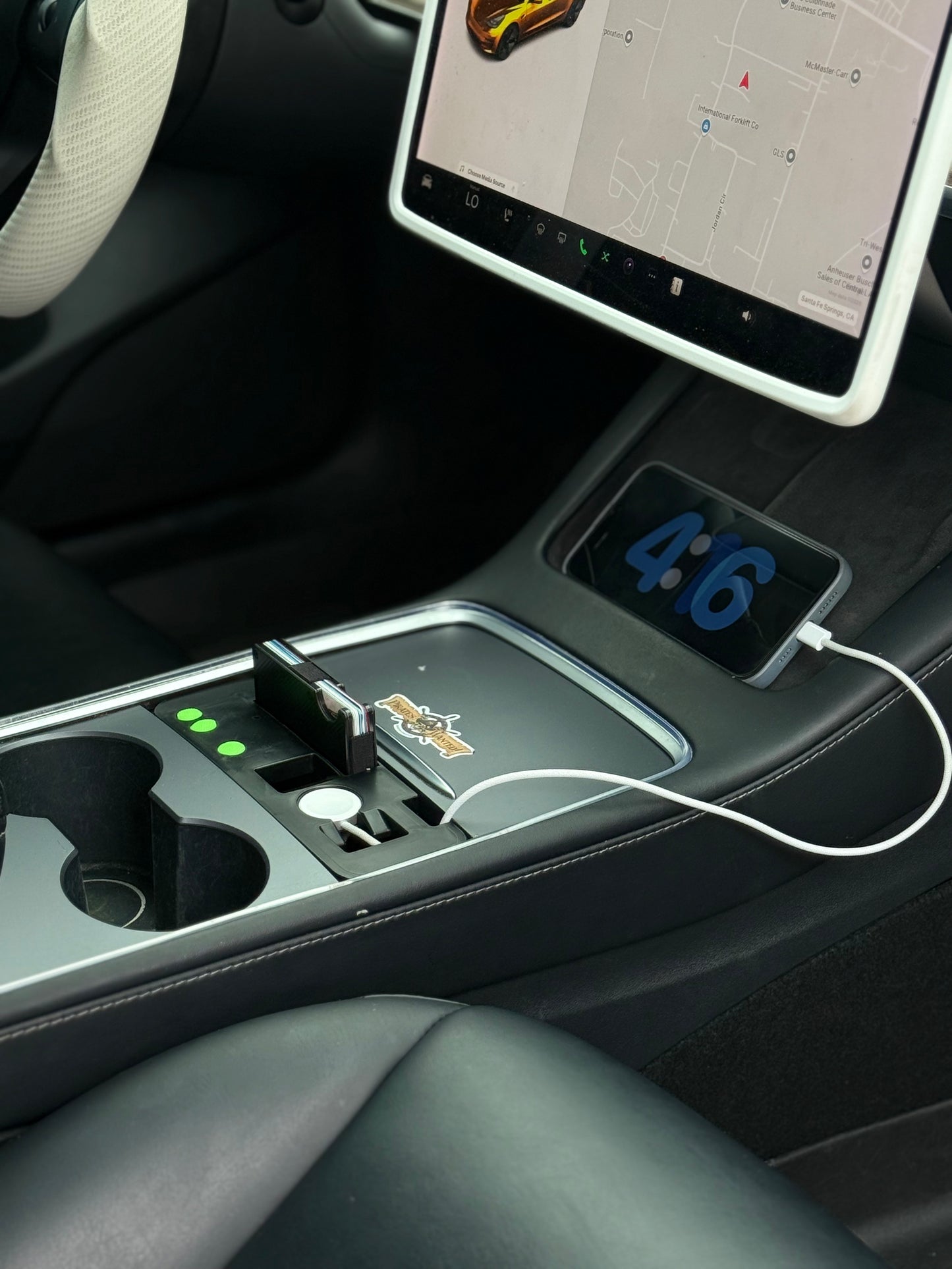 UniHub Control Panel for Tesla Model 3 & Model Y (2021–Present) installed in center console, featuring USB ports, device slots, and organized charging setup.
