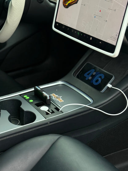UniHub Control Panel for Tesla Model 3 & Model Y (2021–Present) installed in center console, featuring USB ports, device slots, and organized charging setup.