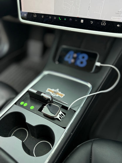UniHub Control Panel for Tesla Model 3 & Model Y (2021–Present) installed in center console with Apple Watch and phone charging. Features organized compartments and USB ports.