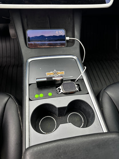 UniHub Control Panel for Tesla Model 3 & Model Y (2021–Present) installed in center console with Apple Watch and iPhone charging. Features organized storage and dual charging ports.