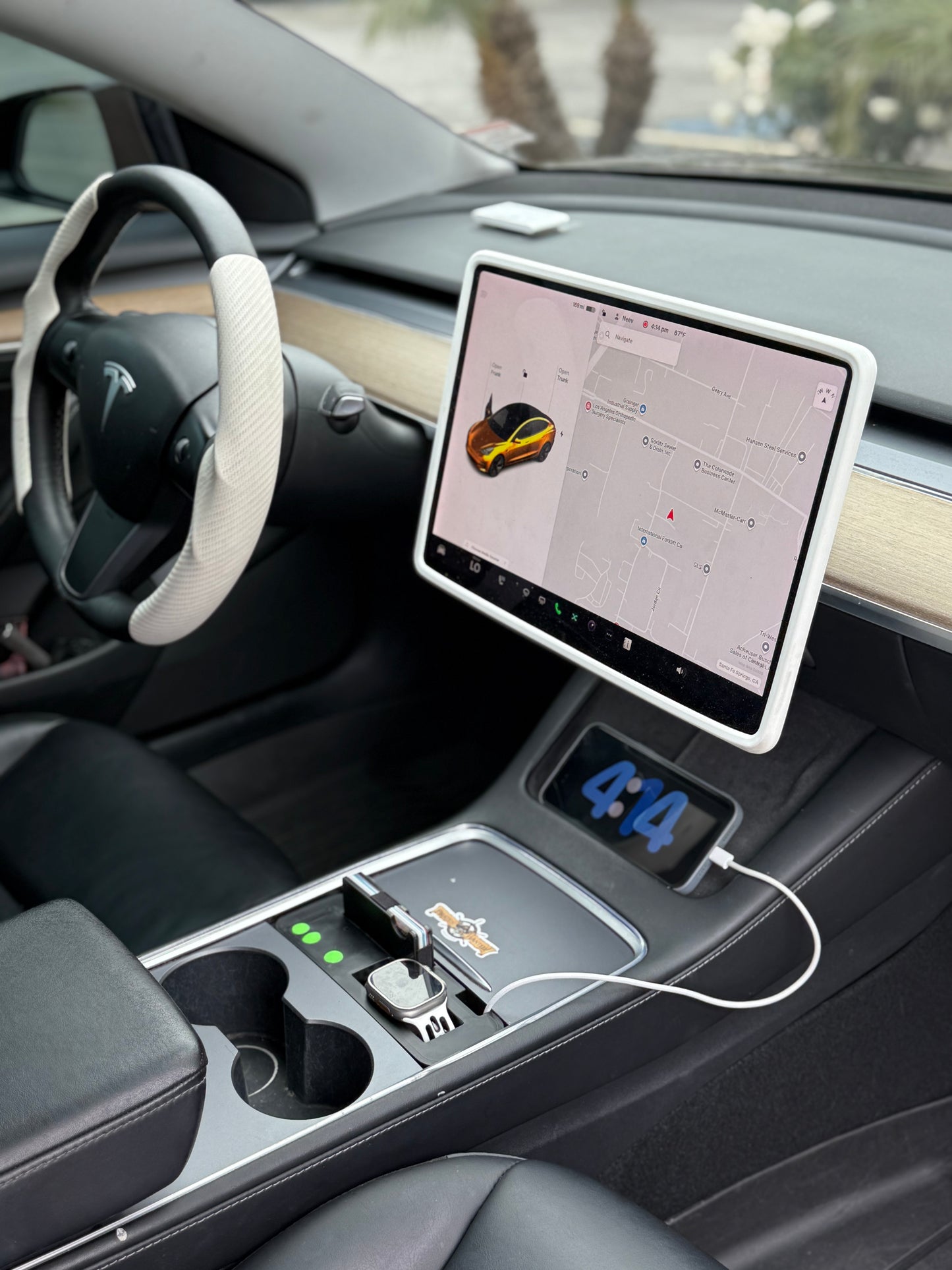 UniHub Control Panel for Tesla Model 3 & Model Y (2021–Present) installed in center console with organized charging ports and digital clock display.